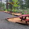 Landscape construction- retaining wall, parking area, simple arbor with planter borders