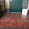 New brick veneer over old concrete porch. Original steep slope was corrected and bottom step was extended for ease and comfortable access to front entry of home. Edmonds, WA 2013